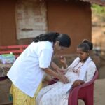 The doctor is conducting a routine examination and providing prenatal care to ensure the well-being of the expectant mother. The scene suggests a community outreach effort, as the medical camp takes place in a rural area, indicating efforts to bring essential healthcare services to underserved populations. The Video portrays the doctor's dedication to providing healthcare support to pregnant women, particularly in areas with limited access to medical facilities.